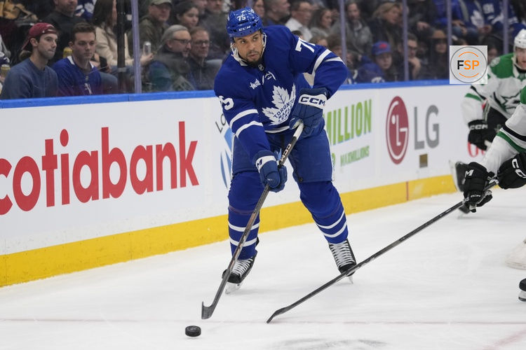 Jan 14, 2025; Toronto, Ontario, CAN; Toronto Maple Leafs forward Ryan Reaves (75) passes the puck against the Dallas Stars during the first period at Scotiabank Arena. Credit: John E. Sokolowski-Imagn Images