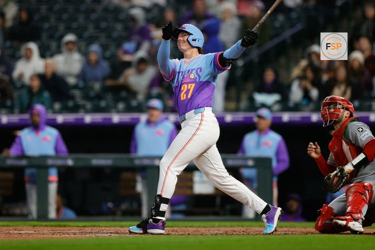 Apr 25, 2025; Denver, Colorado, USA; Colorado Rockies left fielder Jordan Beck (27) watches his ball on a solo home run in the third inning against the Cincinnati Reds at Coors Field. Credit: Isaiah J. Downing-Imagn Images
