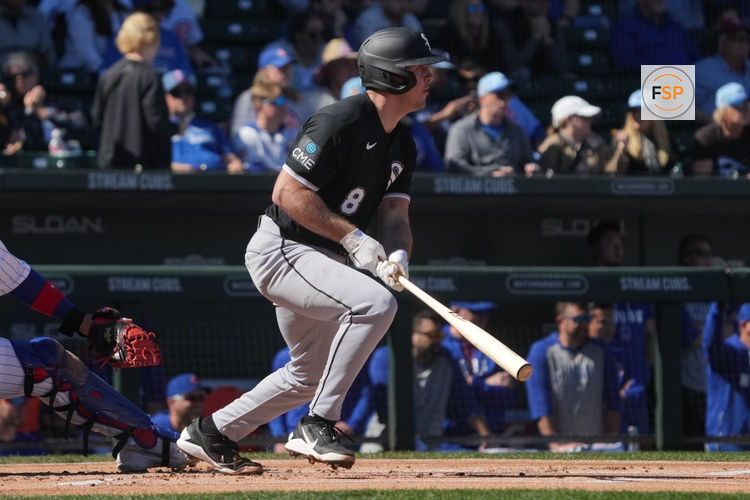 Feb 20, 2026; Mesa, Arizona, USA; Chicago White Sox catcher Kyle Teel (8) hits against the Chicago Cubs in the first inning at Sloan Park. Credit: Rick Scuteri-Imagn Images