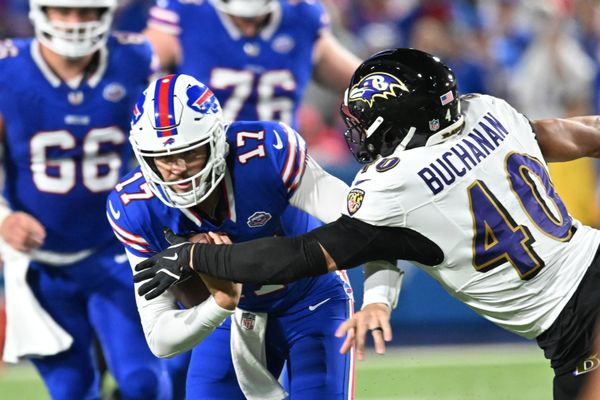 Sep 7, 2025; Orchard Park, New York, USA;  Buffalo Bills quarterback Josh Allen (17) runs the ball defended by Baltimore Ravens linebacker Teddye Buchanan (40) during the third quarter at Highmark Stadium. Mandatory Credit: Mark Konezny-Imagn Images