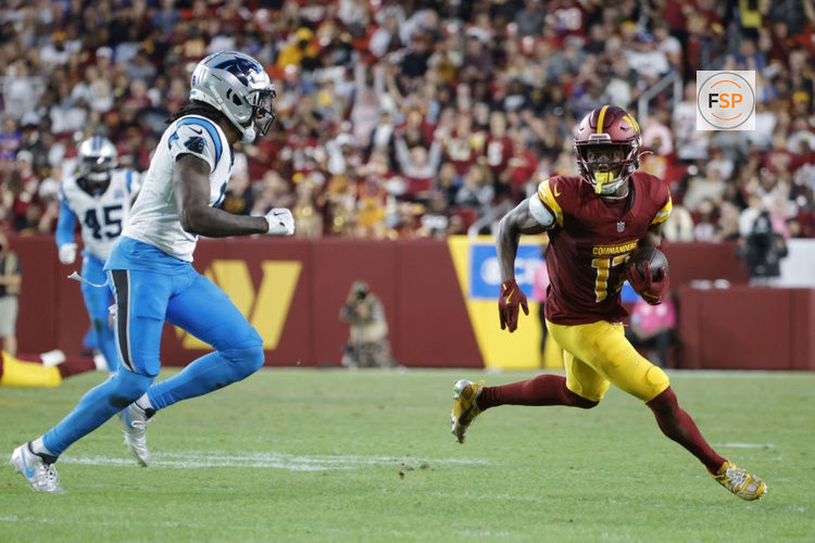 Oct 20, 2024; Landover, Maryland, USA; Washington Commanders wide receiver Terry McLaurin (17) carries the ball as Carolina Panthers cornerback Jaycee Horn (8) defends during the second half at Northwest Stadium. Credit: Amber Searls-Imagn Images