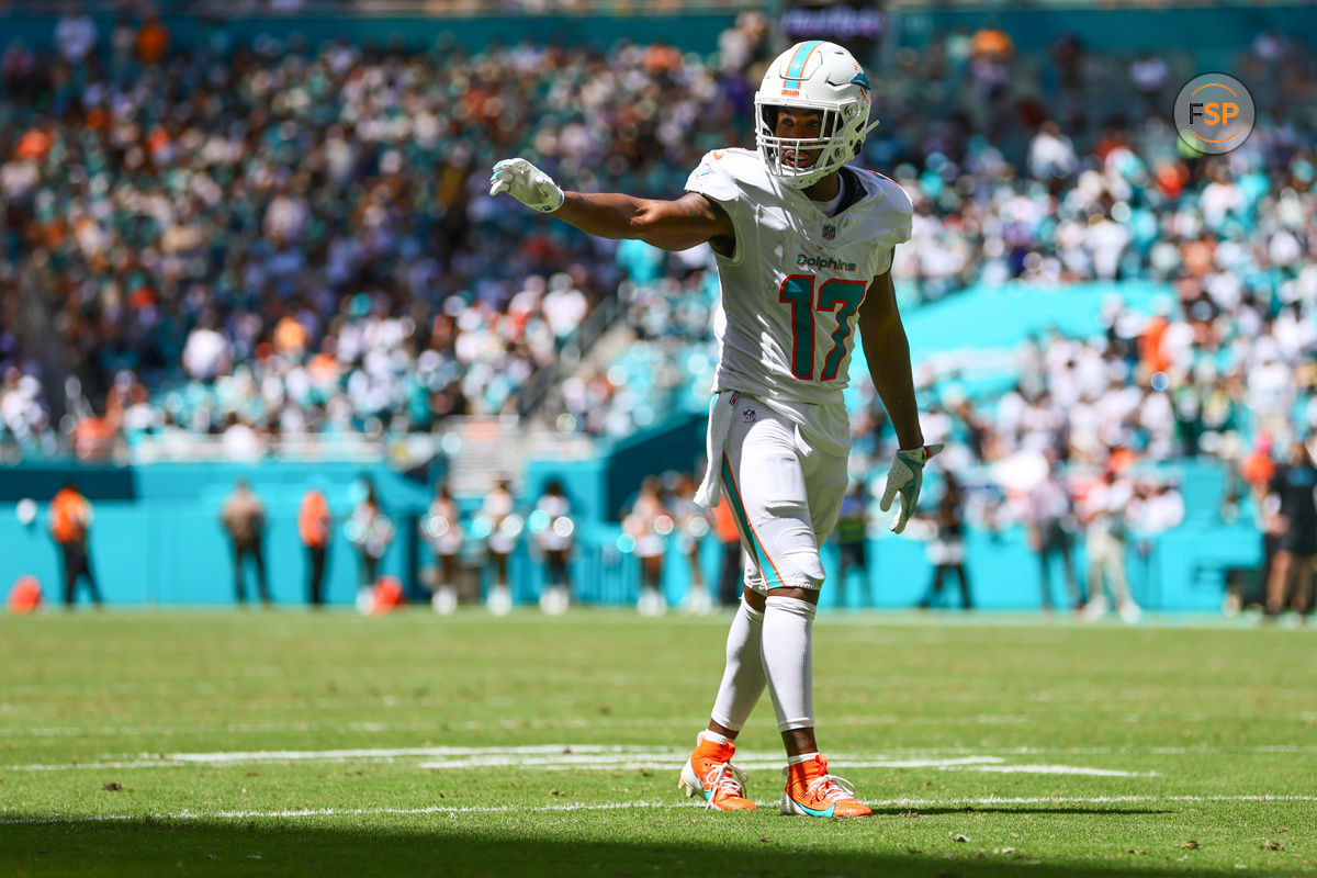 Sep 8, 2024; Miami Gardens, Florida, USA; Miami Dolphins wide receiver Jaylen Waddle (17) signals toward the sideline against the Jacksonville Jaguars during the second quarter at Hard Rock Stadium. Credit: Sam Navarro-Imagn Images