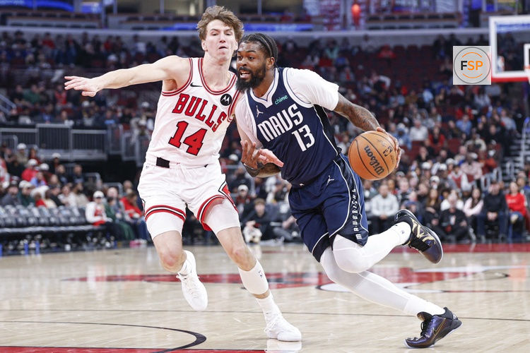 Jan 10, 2026; Chicago, Illinois, USA; Dallas Mavericks forward Naji Marshall (13) drives to the basket against Chicago Bulls forward Matas Buzelis (14) during the second half at United Center. Credit: Kamil Krzaczynski-Imagn Images