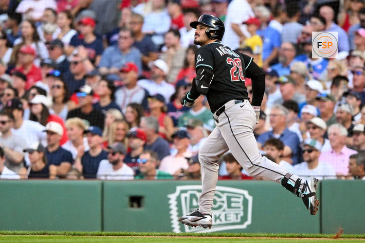 Aug 19, 2026; Boston, Massachusetts, USA; Arizona Diamondbacks third baseman Nolan Arenado (28) watches the ball after hitting single against the Boston Red Sox during the sixth inning at Fenway Park. Credit: Brian Fluharty-Imagn Images