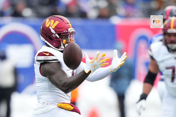 Dec 14, 2025; East Rutherford, New Jersey, USA;  Washington Commanders wide receiver Deebo Samuel (1) drops a pass during the first quarter against the New York Giants at MetLife Stadium. Credit: Robert Deutsch-Imagn Images