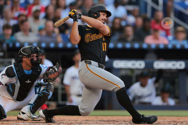 Mar 27, 2025; Miami, Florida, USA; Pittsburgh Pirates left fielder Bryan Reynolds (10) hits a two-run single against the Miami Marlins during the fifth inning at loanDepot Park. Credit: Sam Navarro-Imagn Images
