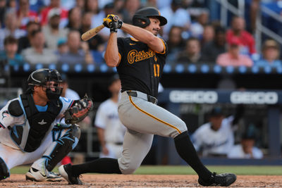 Mar 27, 2025; Miami, Florida, USA; Pittsburgh Pirates left fielder Bryan Reynolds (10) hits a two-run single against the Miami Marlins during the fifth inning at loanDepot Park. Mandatory Credit: Sam Navarro-Imagn Images