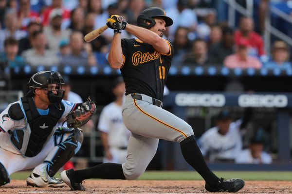 Mar 27, 2025; Miami, Florida, USA; Pittsburgh Pirates left fielder Bryan Reynolds (10) hits a two-run single against the Miami Marlins during the fifth inning at loanDepot Park. Mandatory Credit: Sam Navarro-Imagn Images