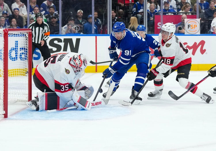 Oct 3, 2026; Toronto, Ontario, CAN;  Toronto Maple Leafs center John Tavares (91) battles for the puck with Ottawa Senators center Tim Stutzle (18) during the first period at Scotiabank Arena.  Credit: Nick Turchiaro-Imagn Images