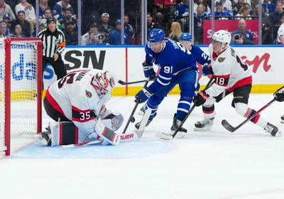 Oct 3, 2026; Toronto, Ontario, CAN;  Toronto Maple Leafs center John Tavares (91) battles for the puck with Ottawa Senators center Tim Stutzle (18) during the first period at Scotiabank Arena.  Mandatory Credit: Nick Turchiaro-Imagn Images