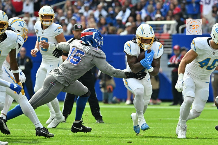 Sep 27, 2026; Orchard Park, New York, USA;  Los Angeles Chargers running back Omarion Hampton (8) runs the ball in the first quarter against the Buffalo Bills at New Highmark Stadium.  Credit: Mark Konezny-Imagn Images