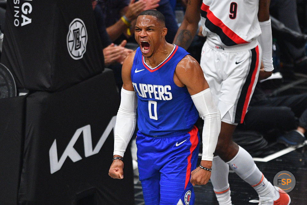 LOS ANGELES, CA - OCTOBER 25: Los Angeles Clippers guard Russell Westbrook (0) screams after a dunk during a NBA game between the Denver Nuggets and the Portland Trail Blazers on October 25, 2023 at Crypto.com Arena in Los Angeles, CA. (Photo by Brian Rothmuller/Icon Sportswire)