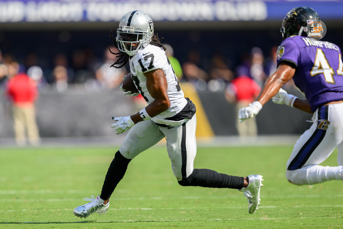 Sep 15, 2024; Baltimore, Maryland, USA; Las Vegas Raiders wide receiver Davante Adams (17) runs with the ball as Baltimore Ravens cornerback Marlon Humphrey (44) defends during the second half at M&T Bank Stadium. Credit: Reggie Hildred-Imagn Images