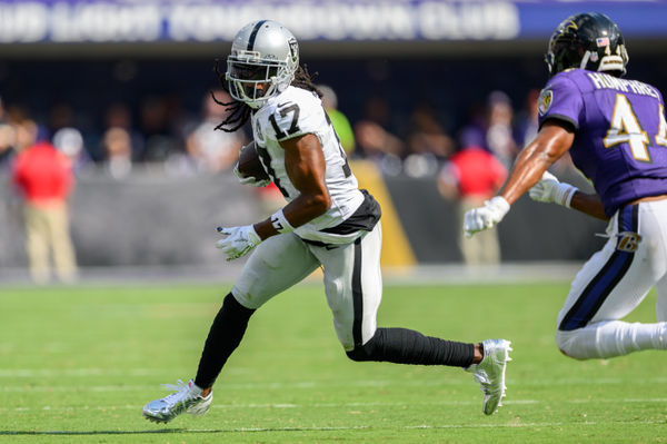 Sep 15, 2024; Baltimore, Maryland, USA; Las Vegas Raiders wide receiver Davante Adams (17) runs with the ball as Baltimore Ravens cornerback Marlon Humphrey (44) defends during the second half at M&T Bank Stadium. Mandatory Credit: Reggie Hildred-Imagn Images