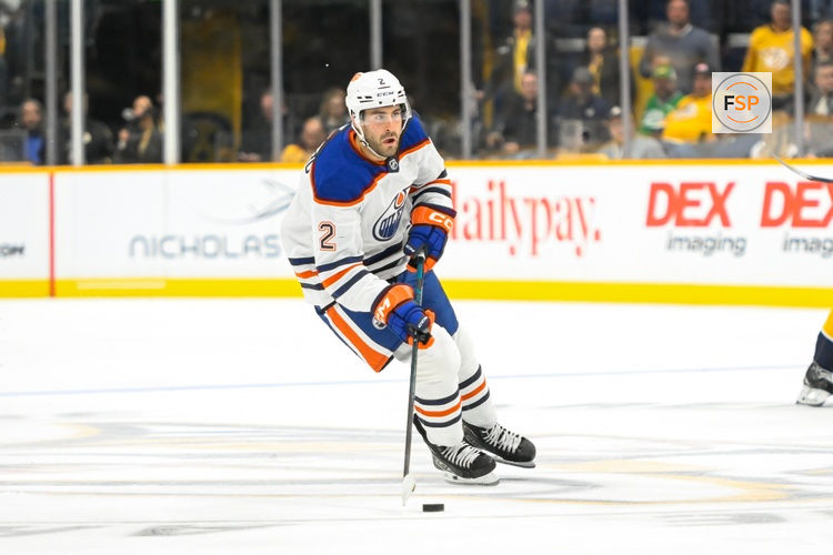 Oct 17, 2024; Nashville, Tennessee, USA;  Edmonton Oilers defenseman Evan Bouchard (2) skates with the puck against the Nashville Predators during the second period at Bridgestone Arena. Credit: Steve Roberts-Imagn Images