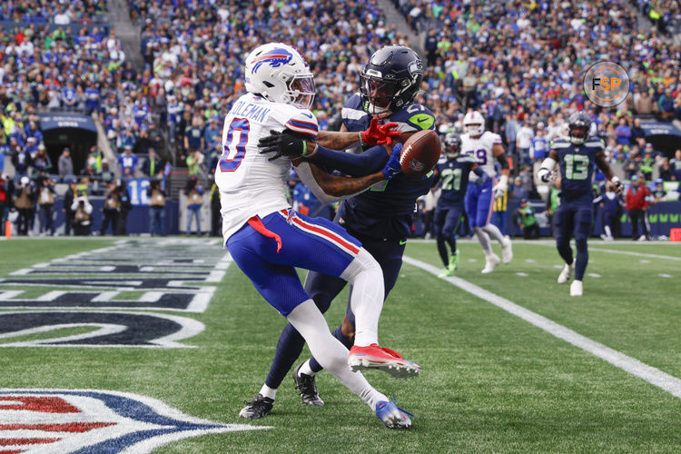 Oct 27, 2024; Seattle, Washington, USA; Seattle Seahawks cornerback Riq Woolen (27) breaks up a potential touchdown pass to Buffalo Bills wide receiver Keon Coleman (0) during the first quarter at Lumen Field. Credit: Joe Nicholson-Imagn Images