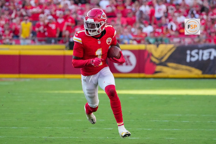 Sep 28, 2025; Kansas City, Missouri, USA; Kansas City Chiefs wide receiver Xavier Worthy (1) runs the ball against the Baltimore Ravens during the game at GEHA Field at Arrowhead Stadium. Credit: Denny Medley-Imagn Images