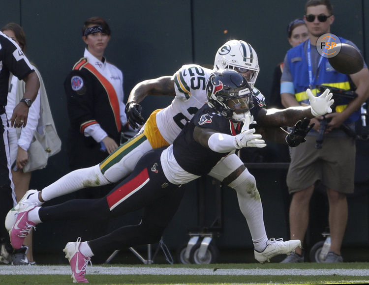 Oct 20, 2024; Green Bay, Wisconsin, USA; Green Bay Packers cornerback Keisean Nixon (25) breaks up a mpass to Houston Texans wide receiver Stefon Diggs (1)  at Lambeau Field . Credit: William Glasheen/Appleton Post-Crescent via the USA TODAY NETWORK-Wisconsin-Imagn Images