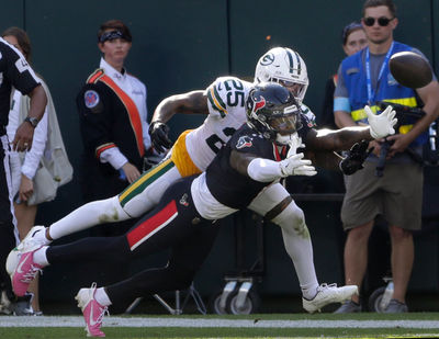 Oct 20, 2024; Green Bay, Wisconsin, USA; Green Bay Packers cornerback Keisean Nixon (25) breaks up a mpass to Houston Texans wide receiver Stefon Diggs (1)  at Lambeau Field . Mandatory Credit: William Glasheen/Appleton Post-Crescent via the USA TODAY NETWORK-Wisconsin-Imagn Images