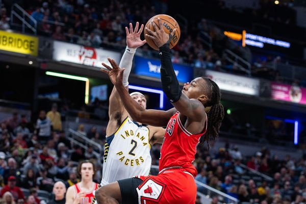 Jan 28, 2026; Indianapolis, Indiana, USA;  Chicago Bulls guard Ayo Dosunmu (11) shoots the ball while Indiana Pacers guard/forward Andrew Nembhard (2) defends in the first half at Gainbridge Fieldhouse. Mandatory Credit: Trevor Ruszkowski-Imagn Images
