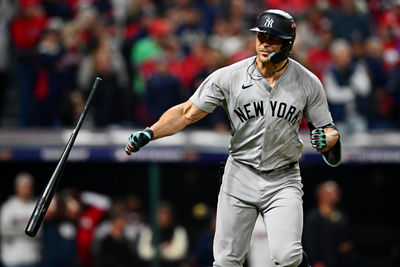 Oct 19, 2024; Cleveland, Ohio, USA; New York Yankees designated hitter Giancarlo Stanton (27) celebrates after hitting a two run home run during the sixth inning against the Cleveland Guardians during game five of the ALCS for the 2024 MLB playoffs at Progressive Field. Mandatory Credit: David Dermer-Imagn Images