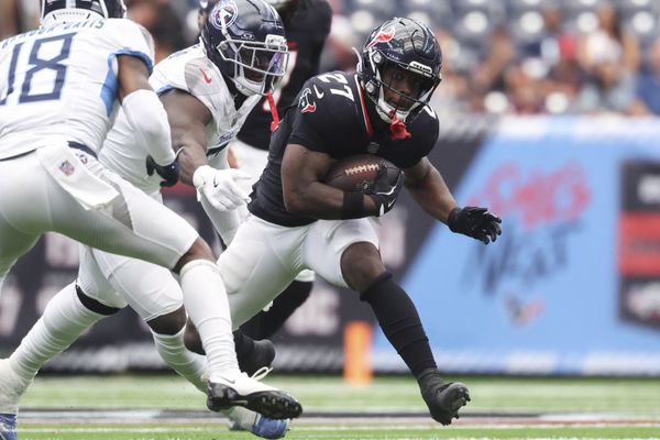 Sep 28, 2025; Houston, Texas, USA; Houston Texans running back Woody Marks (27) runs with the ball during the third quarter against the Tennessee Titans at NRG Stadium. Mandatory Credit: Troy Taormina-Imagn Images