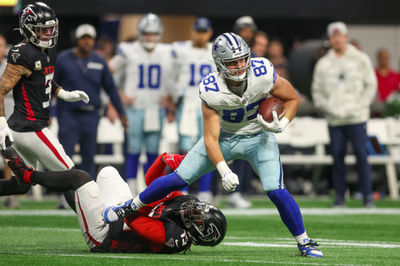 Nov 3, 2024; Atlanta, Georgia, USA; Dallas Cowboys tight end Jake Ferguson (87) breaks the tackle of Atlanta Falcons linebacker Matthew Judon (15) in the first quarter at Mercedes-Benz Stadium. Mandatory Credit: Brett Davis-Imagn Images