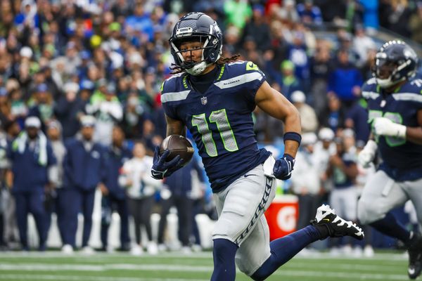 Nov 24, 2024; Seattle, Washington, USA; Seattle Seahawks wide receiver Jaxon Smith-Njigba (11) runs for yards after the catch against the Arizona Cardinals during the second quarter at Lumen Field. Mandatory Credit: Joe Nicholson-Imagn Images