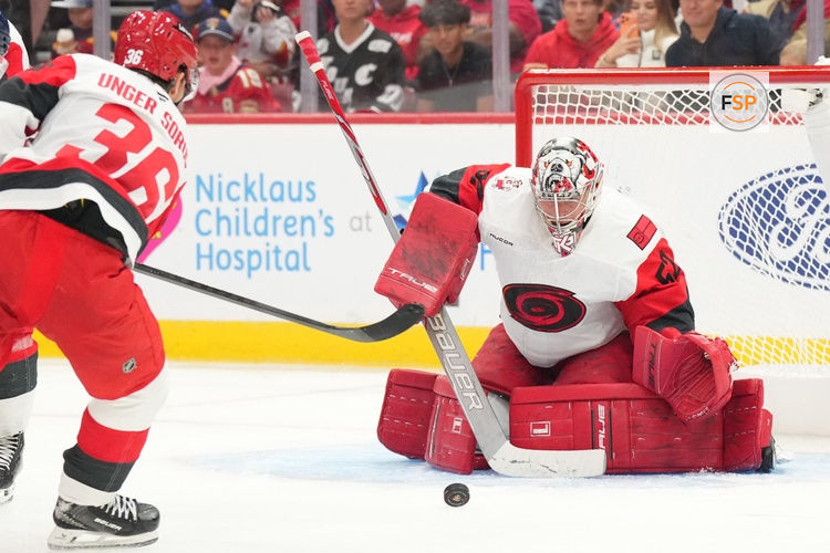 Sep 20, 2026; Sunrise, Florida, USA;  Carolina Hurricanes goalie Pyotr Kochetkov (52) makes a save against the Florida Panthers during the second period at Amerant Bank Arena.  Credit: Jim Rassol-Imagn Images