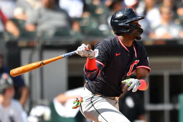 Jul 12, 2025; Chicago, Illinois, USA; Cleveland Guardians center fielder Angel Martinez (1) hits a sacrifice RBI during the fourth inning against the Chicago White Sox at Rate Field. Mandatory Credit: Patrick Gorski-Imagn Images