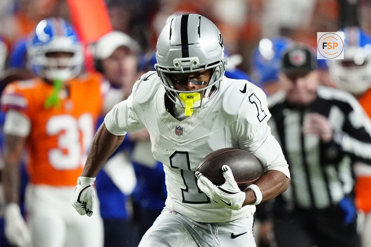 Nov 6, 2025; Denver, Colorado, USA; Las Vegas Raiders wide receiver Tre Tucker (1) runs with the ball after catch against the Denver Broncos during the first half at Empower Field at Mile High. Credit: Ron Chenoy-Imagn Images