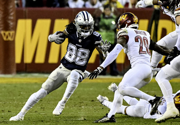 LANDOVER, MD - JANUARY 07: Dallas Cowboys wide receiver CeeDee Lamb (88) makes a reception against Washington Commanders defensive back Quan Martin (20) during the NFL game between the Dallas Cowboys and the Washington Commanders on January 7, 2024 at Fed Ex Field in Landover, MD. (Photo by Mark Goldman/Icon Sportswire)