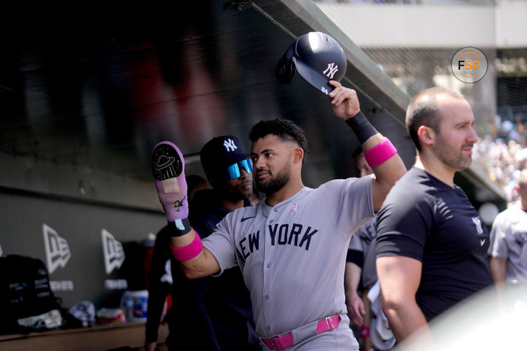 May 11, 2025; West Sacramento, California, USA; New York Yankees left fielder Jasson Dominguez (24) is congratulated by teammates after scoring a run against the Athletics in the second inning at Sutter Health Park. Credit: Cary Edmondson-Imagn Images
