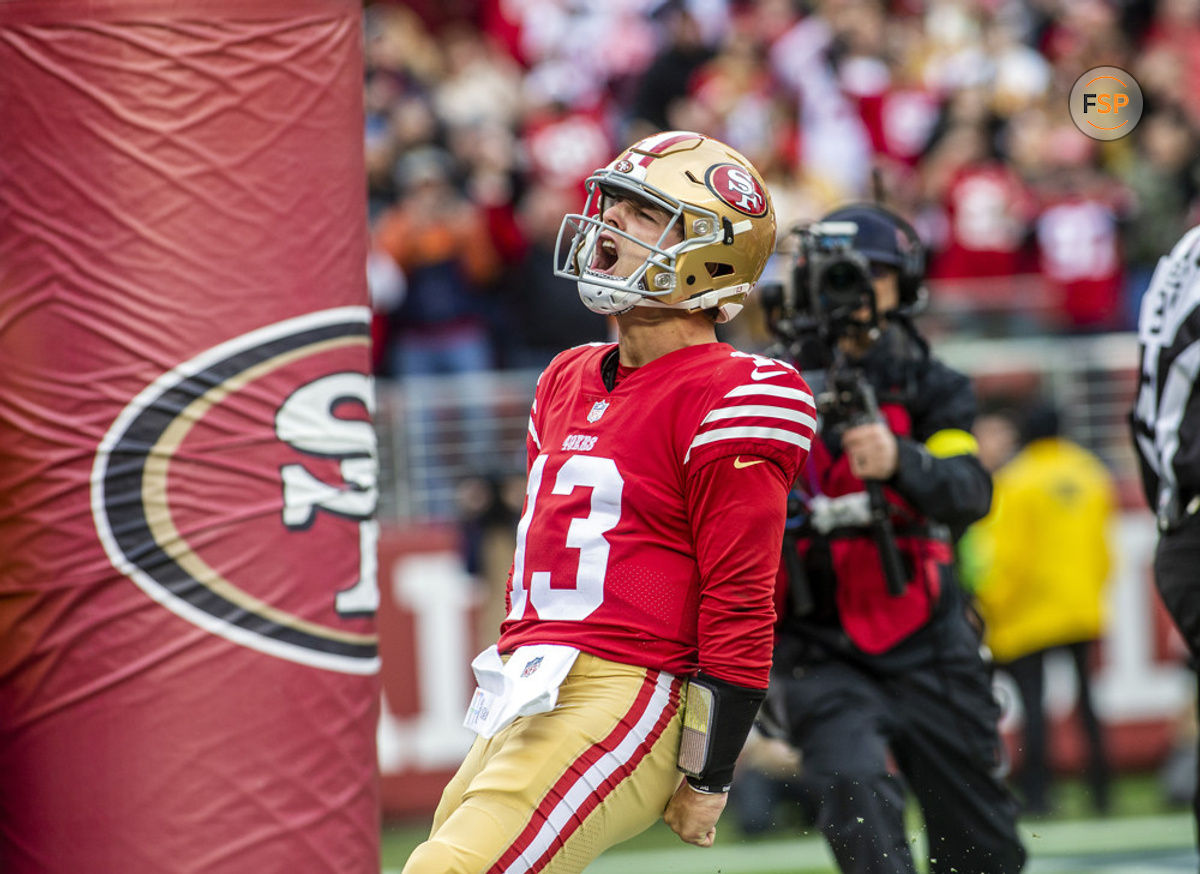 SANTA CLARA, CA - DECEMBER 11: San Francisco 49ers quarterback Brock Purdy (13) celebrates a touchdown in the second quarter of an NFL game between the San Francisco 49ers and Tampa Bay Buccaneers on December 11, 2022, at Levi’s Stadium, in Santa Clara, CA. (Photo by Tony Ding/Icon Sportswire)