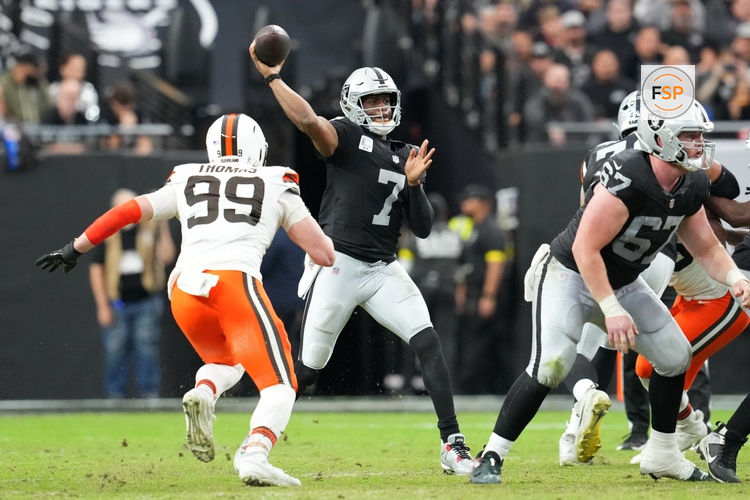 Nov 23, 2025; Paradise, Nevada, USA; Las Vegas Raiders quarterback Geno Smith (7) passes against Cleveland Browns defensive end Cameron Thomas (99) in the first half at Allegiant Stadium. Credit: Stephen R. Sylvanie-Imagn Images