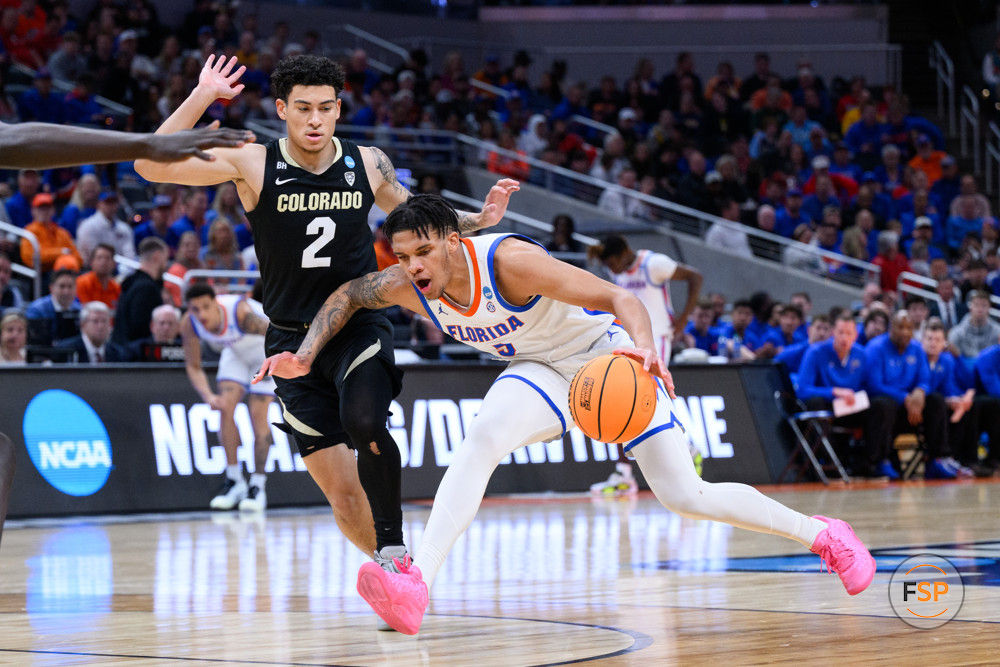 INDIANAPOLIS, IN - MARCH 22: Florida Gators guard Will Richard (5) drives into the lane against Colorado Buffaloes guard KJ Simpson (2) during the Colorado Buffaloes versus the Florida Gators in the first round of the NCAA Division 1 Championship on March 22, 2024, at Gainbridge Fieldhouse in Indianapolis, IN. (Photo by Zach Bolinger/Icon Sportswire)