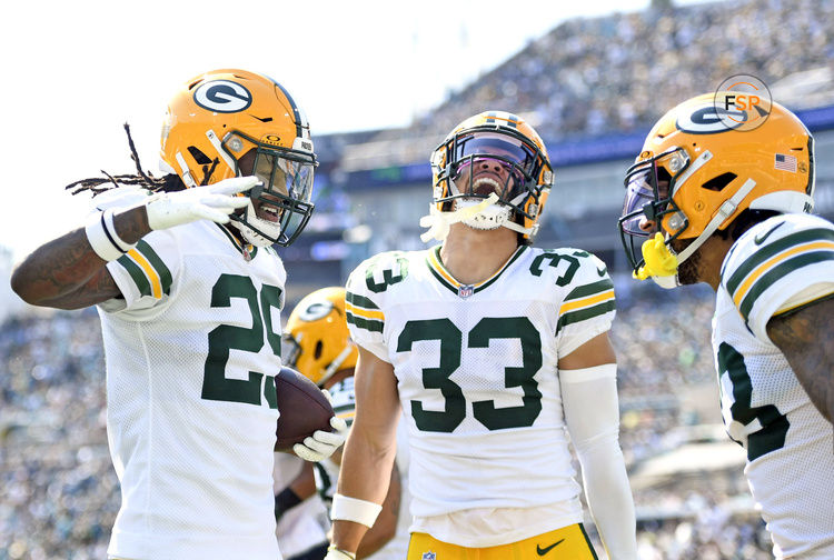 Oct 27, 2024; Jacksonville, Florida, USA; Green Bay Packers safety Xavier McKinney (29) celebrates an interception with safety Evan Williams (33) during the first half against the Jacksonville Jaguars at EverBank Stadium. Credit: Melina Myers-Imagn Images