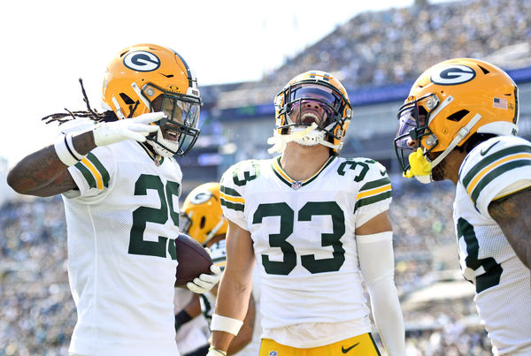 Oct 27, 2024; Jacksonville, Florida, USA; Green Bay Packers safety Xavier McKinney (29) celebrates an interception with safety Evan Williams (33) during the first half against the Jacksonville Jaguars at EverBank Stadium. Mandatory Credit: Melina Myers-Imagn Images