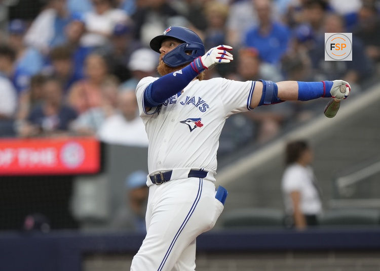 Jun 18, 2024; Toronto, Ontario, CAN; Toronto Blue Jays designated hitter Justin Turner (2) hits a single against the Boston Red Sox during the second inning at Rogers Centre. Credit: John E. Sokolowski-USA TODAY Sports