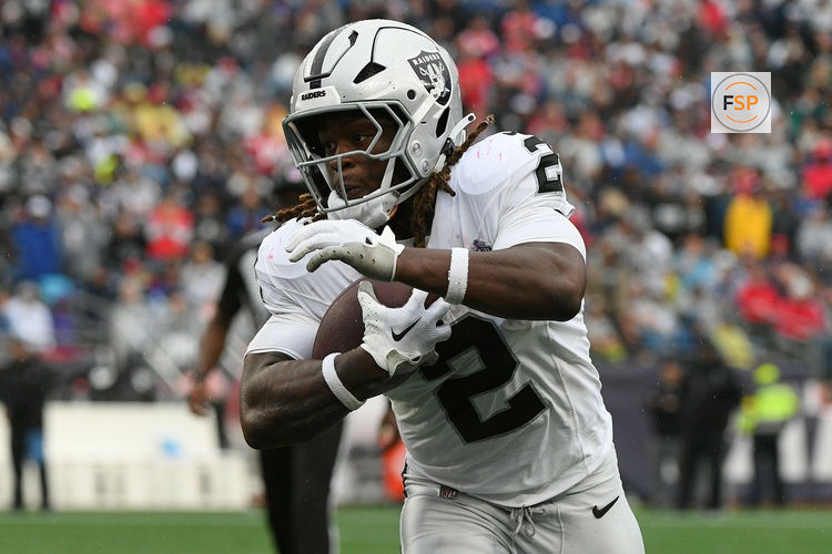 Sep 7, 2025; Foxborough, Massachusetts, USA; Las Vegas Raiders running back Ashton Jeanty (2) rushes the ball against the New England Patriots during he second half at Gillette Stadium. Credit: Bob DeChiara-Imagn Images