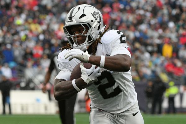Sep 7, 2025; Foxborough, Massachusetts, USA; Las Vegas Raiders running back Ashton Jeanty (2) rushes the ball against the New England Patriots during he second half at Gillette Stadium. Mandatory Credit: Bob DeChiara-Imagn Images