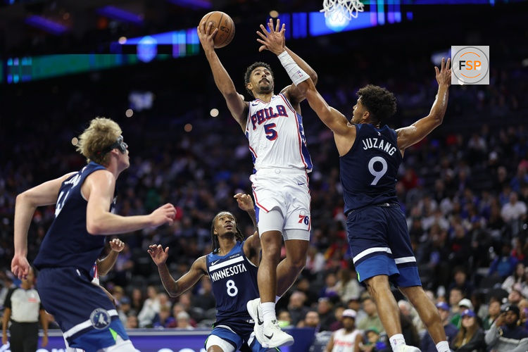 Oct 17, 2025; Philadelphia, Pennsylvania, USA; Philadelphia 76ers guard Quentin Grimes (5) drives for a shot against Minnesota Timberwolves Johnny Juzang (9) during the third quarter at Xfinity Mobile Arena. Credit: Bill Streicher-Imagn Images