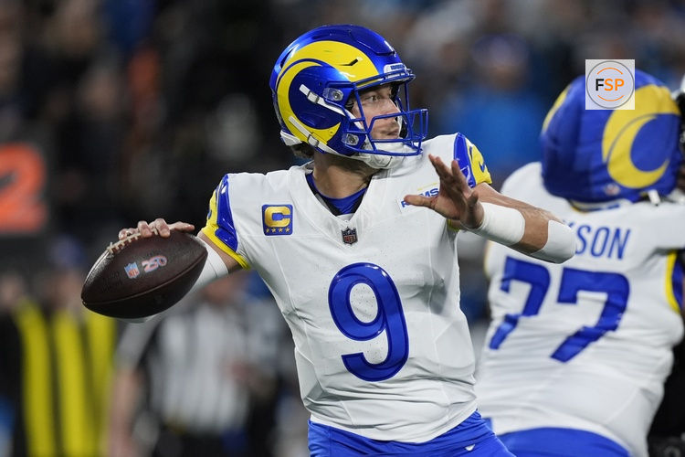 Jan 10, 2026; Charlotte, NC, USA; Los Angeles Rams quarterback Matthew Stafford (9) drops back to pass against the Carolina Panthers in the first half during the NFC Wild Card Round game at Bank of America Stadium. Credit: Jim Dedmon-Imagn Images