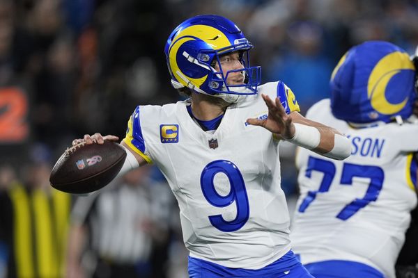 Jan 10, 2026; Charlotte, NC, USA; Los Angeles Rams quarterback Matthew Stafford (9) drops back to pass against the Carolina Panthers in the first half during the NFC Wild Card Round game at Bank of America Stadium. Mandatory Credit: Jim Dedmon-Imagn Images