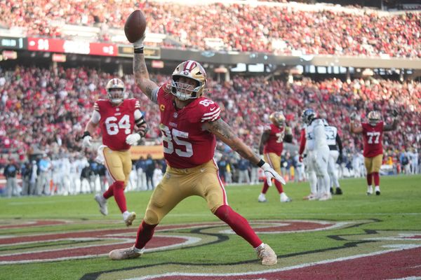 Dec 14, 2025; Santa Clara, California, USA;  San Francisco 49ers tight end George Kittle (85) scores a touchdown during the third quarter against the Tennessee Titans at Levi's Stadium. Mandatory Credit: Cary Edmondson-Imagn Images