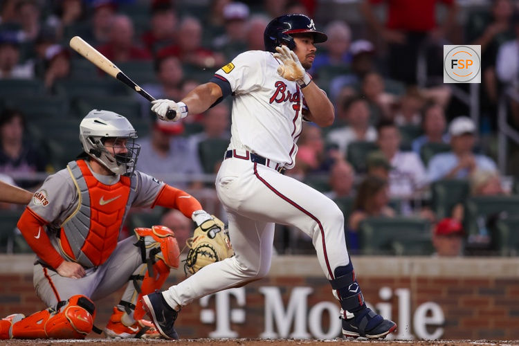 Jul 21, 2025; Atlanta, Georgia, USA; Atlanta Braves catcher Drake Baldwin (30) hits a two-run single against the San Francisco Giants in the fourth inning at Truist Park. Credit: Brett Davis-Imagn Images
