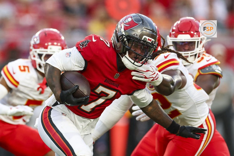Aug 22, 2026; Tampa, Florida, USA; Tampa Bay Buccaneers running back Bucky Irving (7) runs the ball against the Kansas City Chiefs in the first quarter during a preseason game at Raymond James Stadium. Credit: Nathan Ray Seebeck-Imagn Images