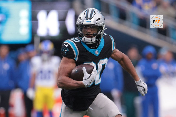 Nov 30, 2025; Charlotte, North Carolina, USA; Carolina Panthers running back Chuba Hubbard (30) rushes during the second quarter against the Los Angeles Rams at Bank of America Stadium. Credit: Scott Kinser-Imagn Images