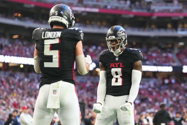 Dec 21, 2025; Glendale, Arizona, USA;  Atlanta Falcons tight end Kyle Pitts Sr. (8) reacts with wide receiver Drake London (5) after catching a touchdown against the Arizona Cardinals during the first half at State Farm Stadium. Mandatory Credit: Joe Camporeale-Imagn Images