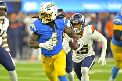 Dec 19, 2024; Inglewood, California, USA;  Los Angeles Chargers running back Gus Edwards (4) runs for a touchdown in the second half against the Denver Broncos at SoFi Stadium. Mandatory Credit: Jayne Kamin-Oncea-Imagn Images